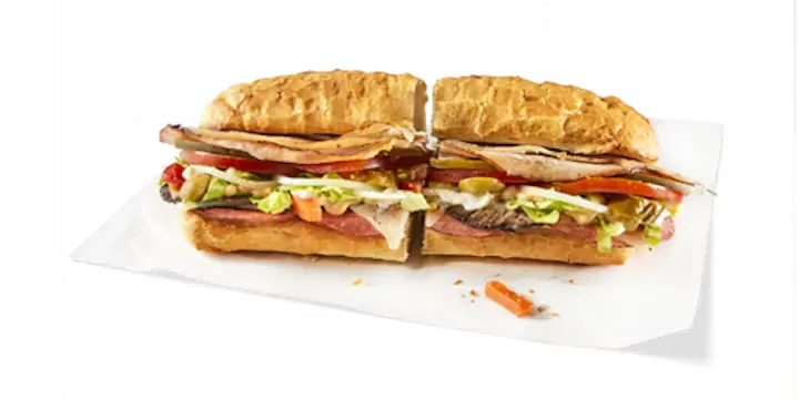 A hearty Potbelly Menu item, the A Wreck, featuring a toasted sub roll packed with turkey breast, hickory smoked ham, Angus roast beef, salami, and melted Swiss cheese, loaded with fresh lettuce, tomatoes, and pickles, cut into portions and served on white paper against a black background, priced at $11.29 with 714 calories.