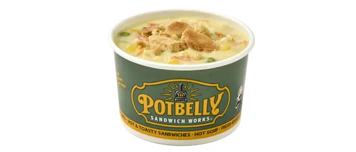 A hearty Potbelly Menu item, the Chicken Pot Pie, featuring a creamy soup with tender slow-roasted chicken breast and fresh veggies, topped with crumbles of flaky pie crust, served in a branded green cup against a black background, priced at $5.49 with 422 calories.