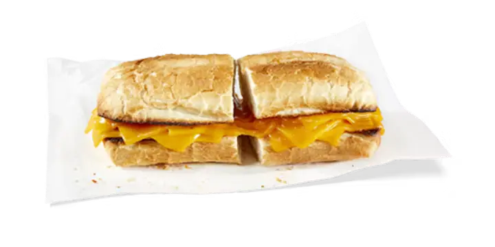 A simple yet comforting Potbelly Menu item, the Grilled Cheese, featuring a toasted sub roll filled with melted cheddar cheese, cut into portions and served on white paper against a black background, priced at $9.99 with 420 calories.