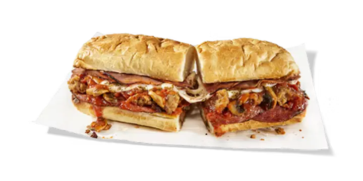A hearty Potbelly Menu item, the Pizza Melt, featuring a toasted sub roll filled with pepperoni, old-world capicola, crumbled meatball, smothered in rich marinara sauce, melted provolone cheese, Italian seasoning, and sautéed mushrooms, cut into portions and served on white paper against a black background, priced at $11.29 with 625 calories (can be made vegetarian).