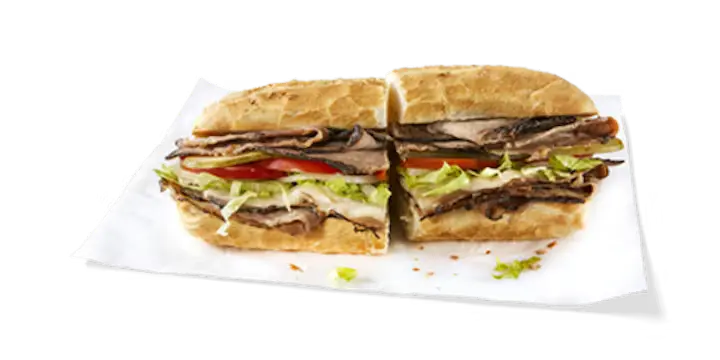 A savory Potbelly Menu item, the Roast Beef, featuring a toasted sub roll filled with tender Angus roast beef, melted provolone cheese, fresh lettuce, tomatoes, and pickles, cut into portions and served on white paper against a black background, priced at $10.89 with 614 calories.